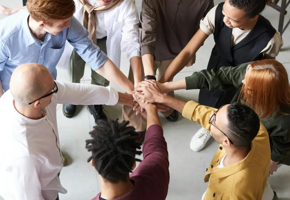 A team celebrating together in a meeting